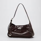 Bolsa hobo Lili Mayzê em couro legítimo. Design sofisticado, alça ajustável e divisórias internas. O toque de luxo e durabilidade que seu look merece.