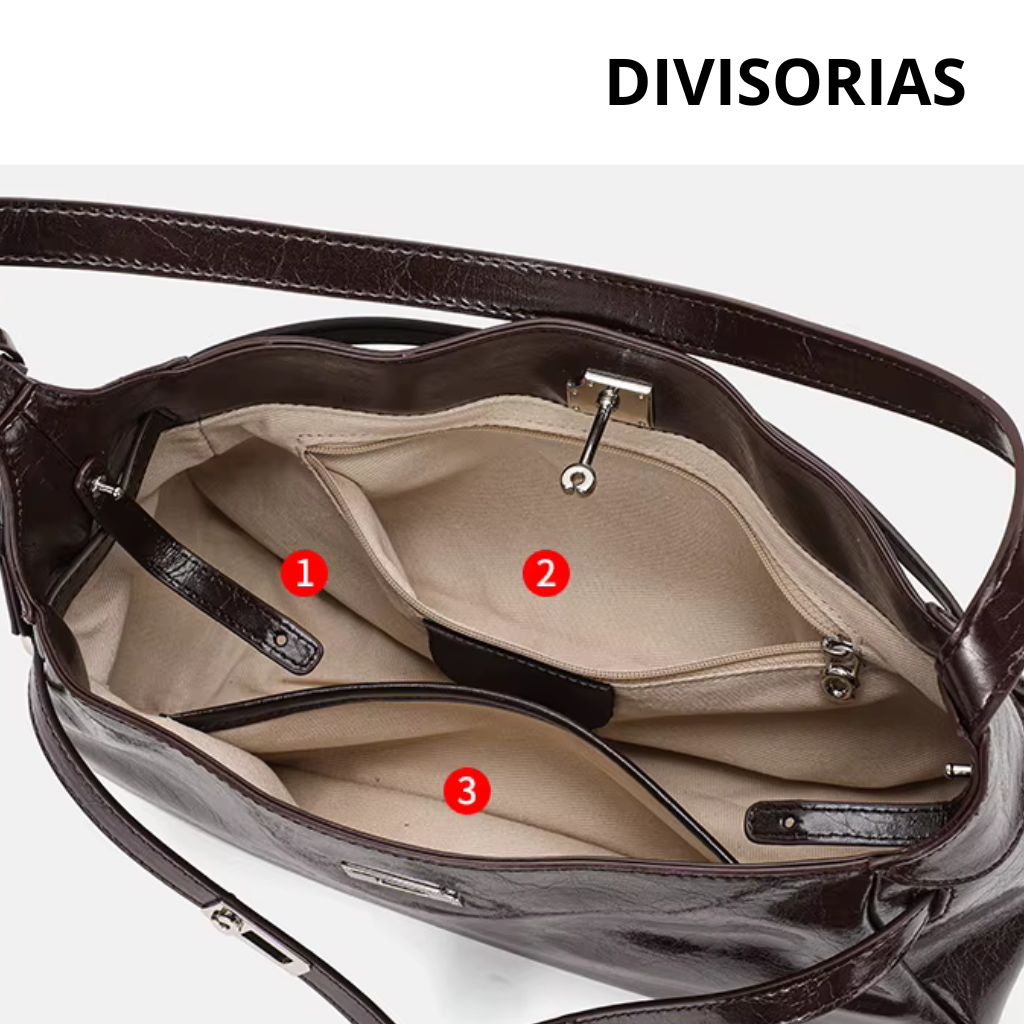 Bolsa hobo Lili Mayzê em couro legítimo. Design sofisticado, alça ajustável e divisórias internas. O toque de luxo e durabilidade que seu look merece.