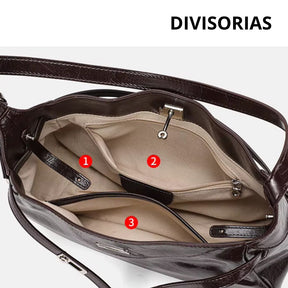 Bolsa hobo Lili Mayzê em couro legítimo. Design sofisticado, alça ajustável e divisórias internas. O toque de luxo e durabilidade que seu look merece.