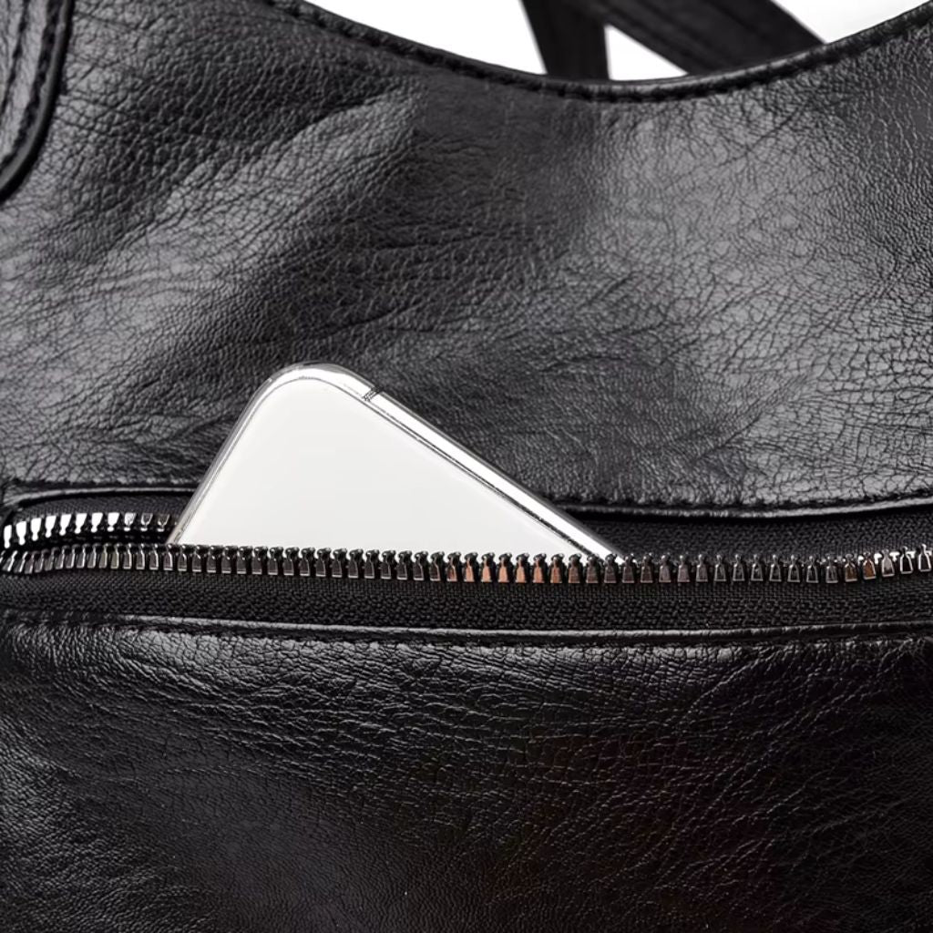 Bolsa média tote Naomi Mayzê. Couro ecológico, vários bolsos, alça transversal removível e ótima organização para o dia a dia.