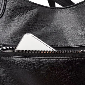 Bolsa média tote Naomi Mayzê. Couro ecológico, vários bolsos, alça transversal removível e ótima organização para o dia a dia.