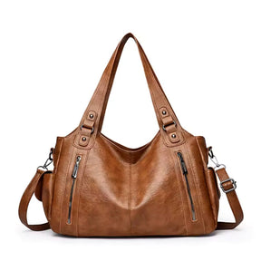 Bolsa média tote Naomi Mayzê. Couro ecológico, vários bolsos, alça transversal removível e ótima organização para o dia a dia.