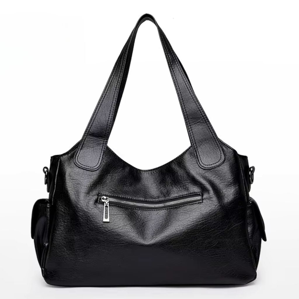 Bolsa média tote Naomi Mayzê. Couro ecológico, vários bolsos, alça transversal removível e ótima organização para o dia a dia.