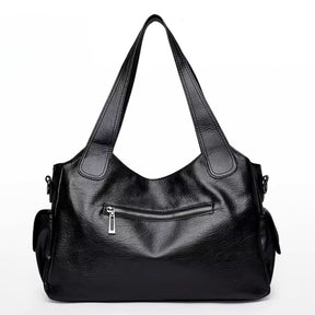 Bolsa média tote Naomi Mayzê. Couro ecológico, vários bolsos, alça transversal removível e ótima organização para o dia a dia.