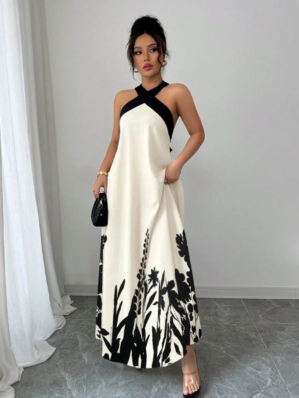 Vestido longo Lien Mayzê com costas abertas e laço. Elegante, fluido e perfeito para casamentos, festas e jantares especiais.