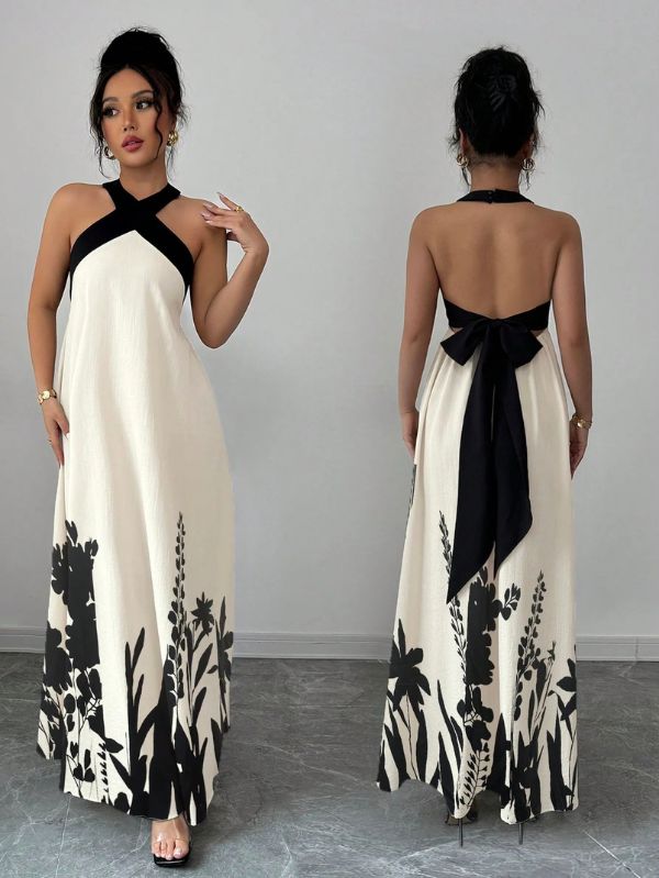 Vestido longo Lien Mayzê com costas abertas e laço. Elegante, fluido e perfeito para casamentos, festas e jantares especiais.