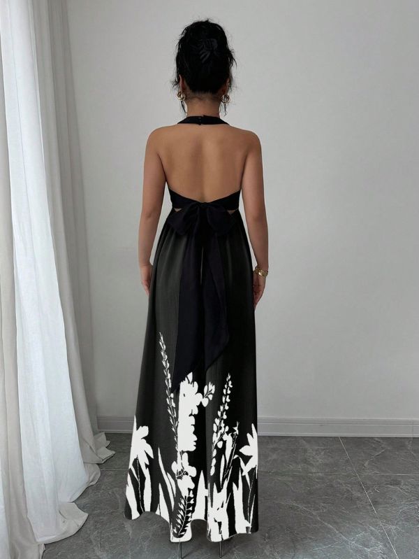 Vestido longo Lien Mayzê com costas abertas e laço. Elegante, fluido e perfeito para casamentos, festas e jantares especiais.