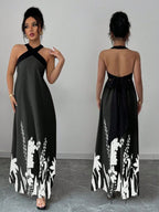 Vestido longo Lien Mayzê com costas abertas e laço. Elegante, fluido e perfeito para casamentos, festas e jantares especiais.