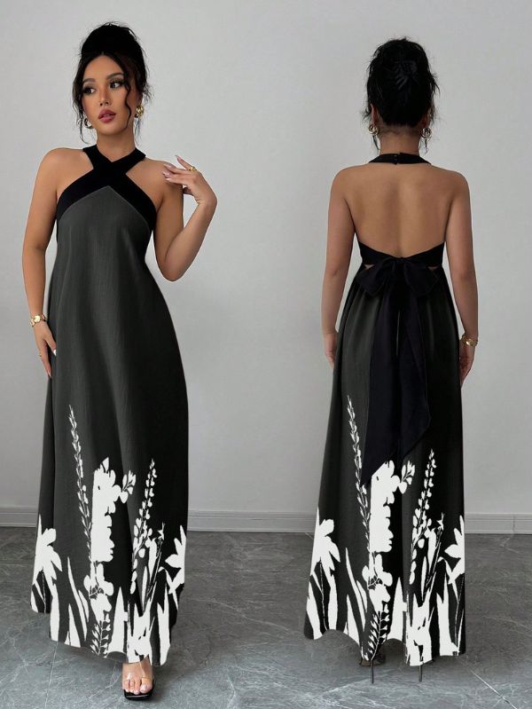 Vestido longo Lien Mayzê com costas abertas e laço. Elegante, fluido e perfeito para casamentos, festas e jantares especiais.