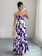Vestido maxi Arbre Mayzê. Cintura marcada, recortes laterais e estampa boho para looks frescos e elegantes na praia e no verão.