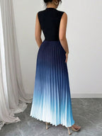 Vestido maxi degradê plissado Doux Mayzê. Saia plissada em A, cintura alta e caimento elegante para festas e eventos noturnos.