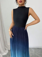 Vestido maxi degradê plissado Doux Mayzê. Saia plissada em A, cintura alta e caimento elegante para festas e eventos noturnos.