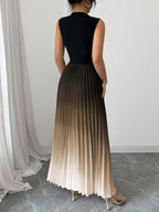 Vestido maxi degradê plissado Doux Mayzê. Saia plissada em A, cintura alta e caimento elegante para festas e eventos noturnos.